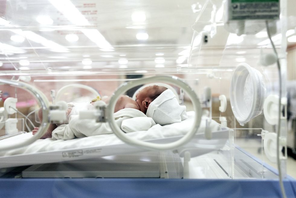 BABY IN INCUBATOR