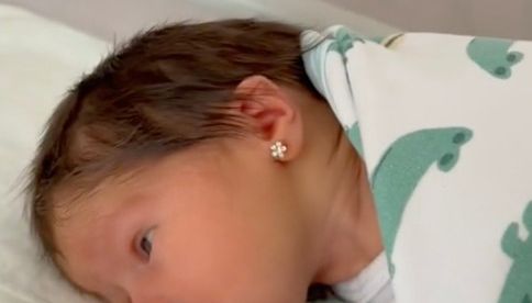 Baby Lara's ears were pierced shortly after her birth