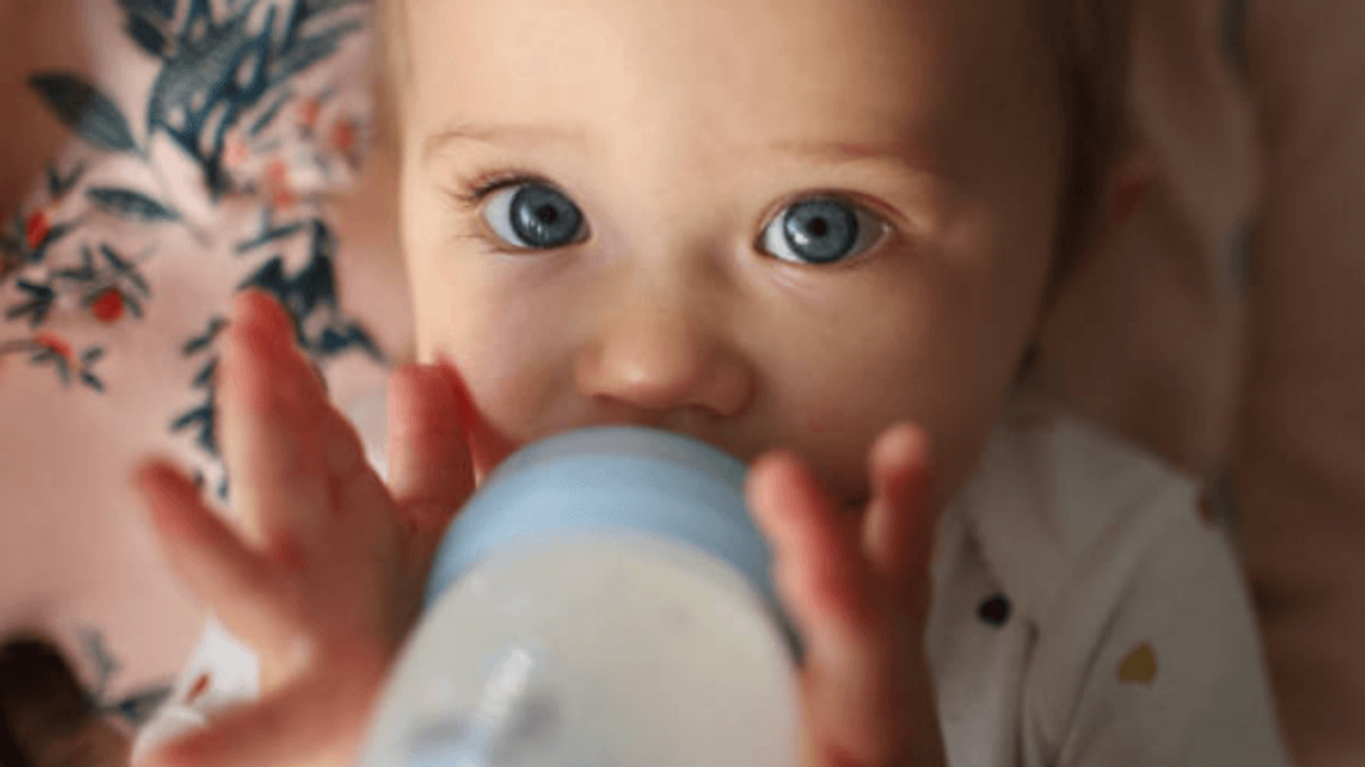 Baby with a baby bottle