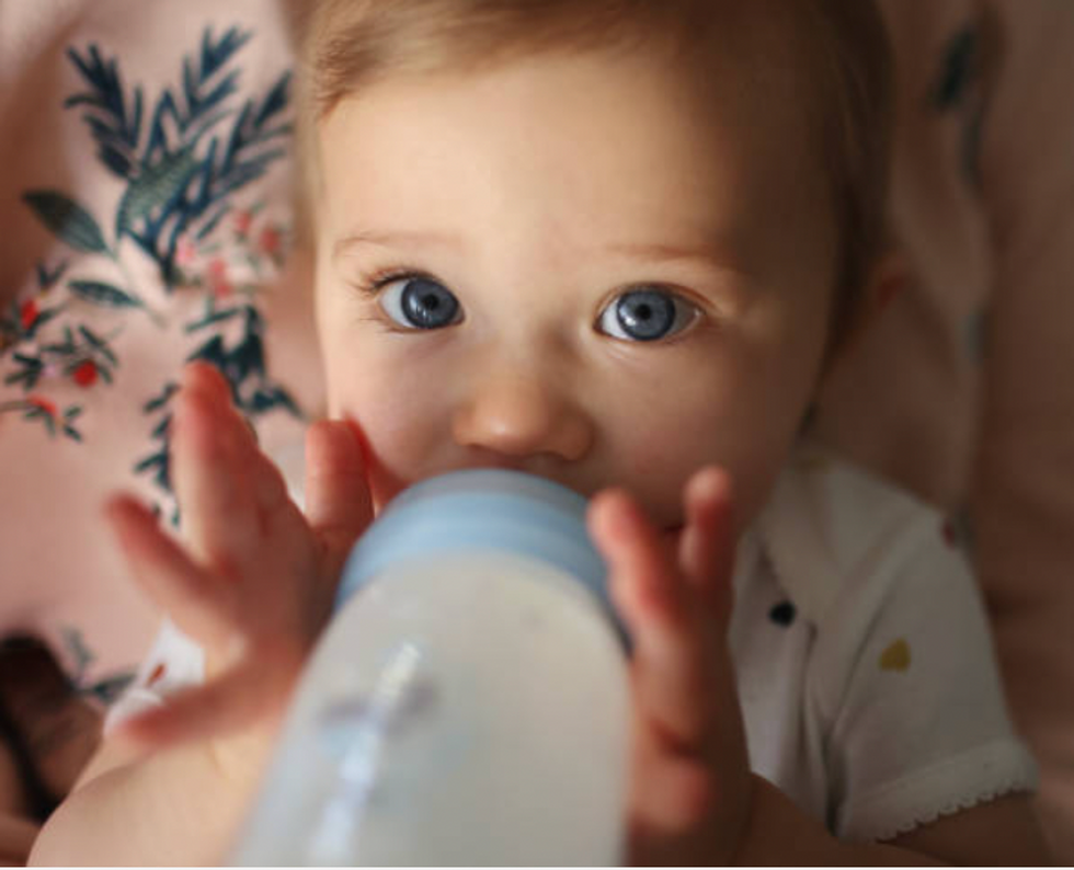 Baby with a baby bottle