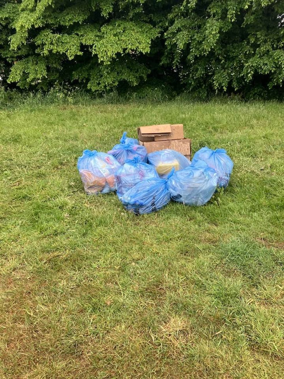 Bags of rubbish on the ground of the park