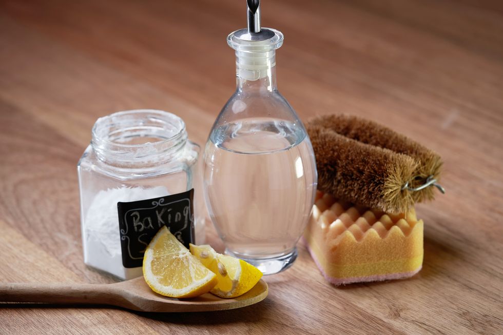 Baking soda, lemon, white vinegar and a brush