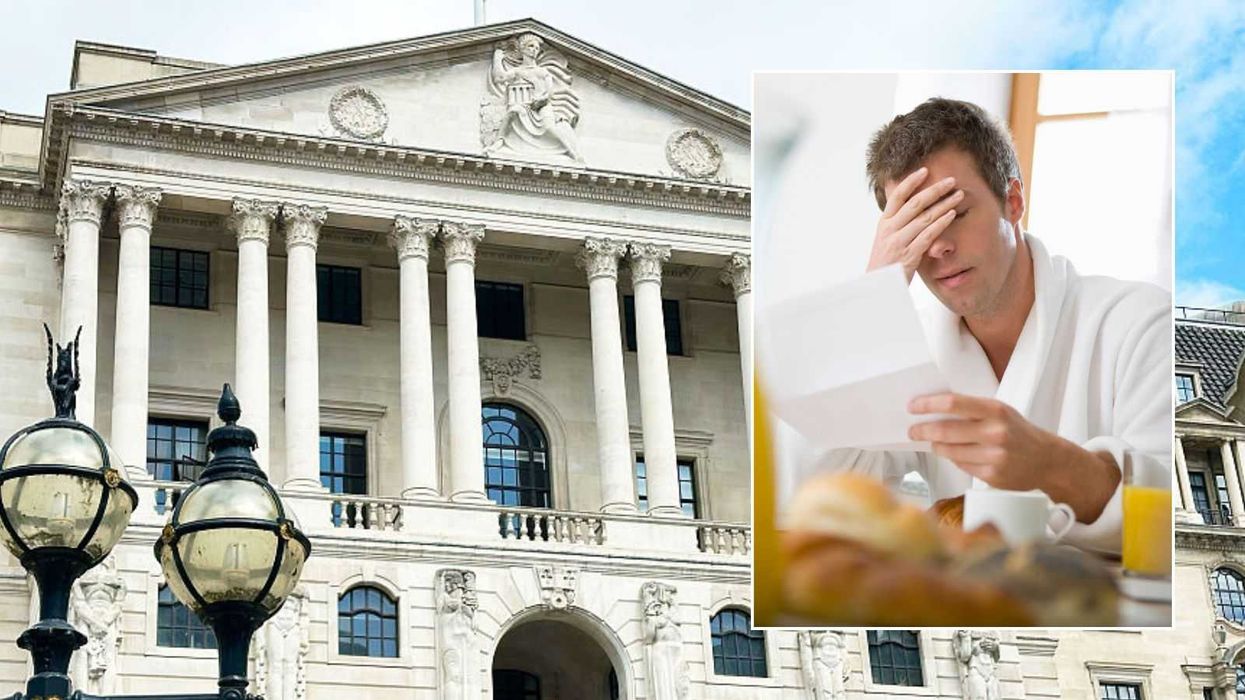Bank of England and man looking at letter
