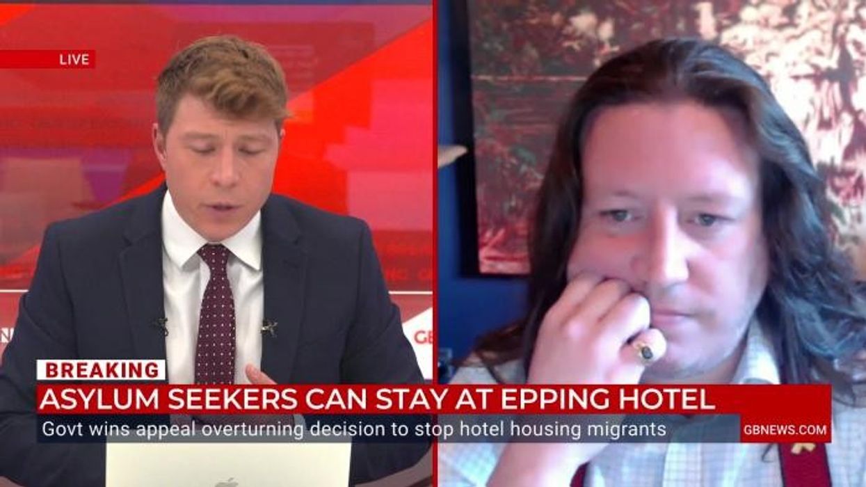 Masked men attempt to storm migrant hotel as five protesters arrested