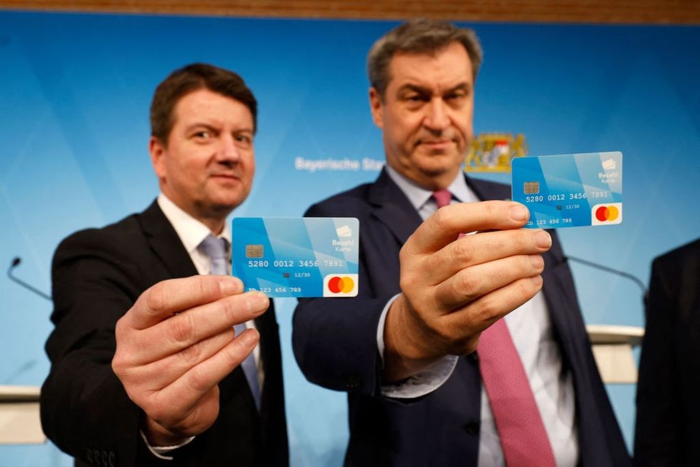 Bavaria's State Premier Markus Soeder (right) and Bavaria's Secretary of State for the Interior Sandro Kirchner (left)