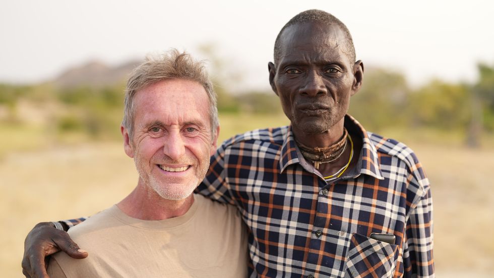BBC Tribe: Bruce with the Mucubal village leader, Chief Keluie