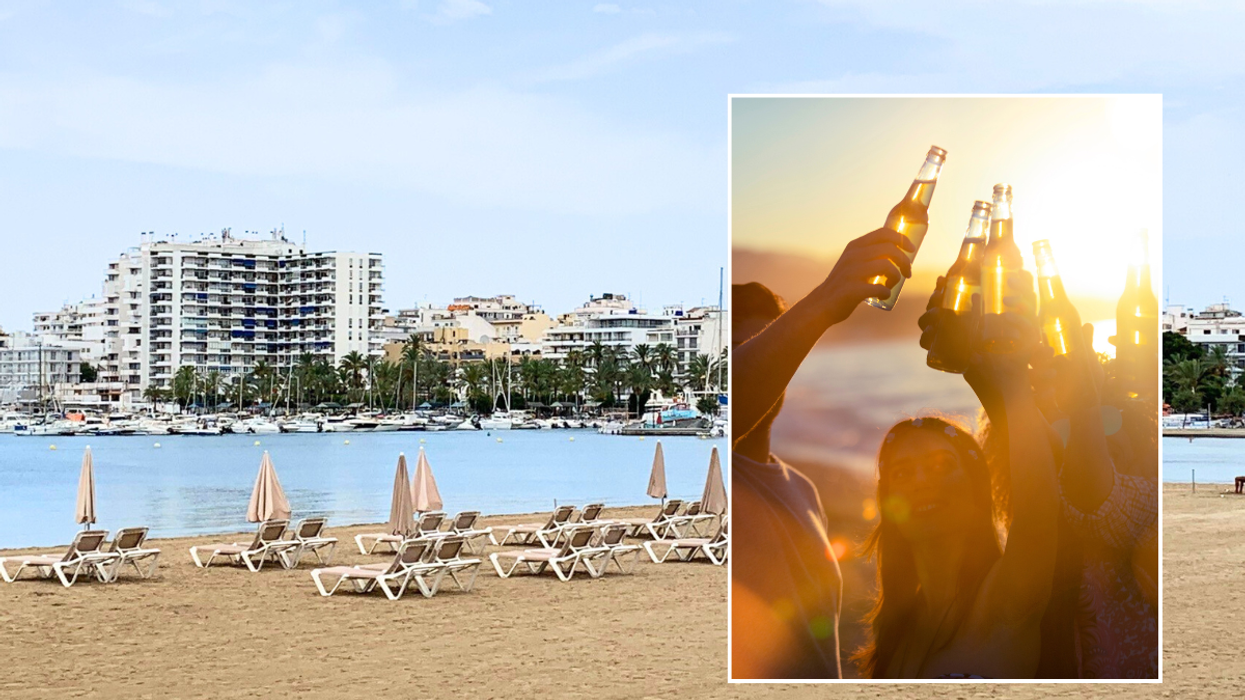 Beach in Ibiza / people drinking beer on beach