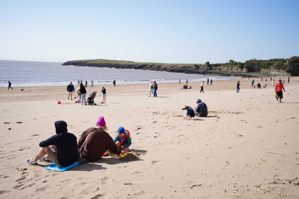 Beachgoers in Barry Island in Wales's Vale of Glamorgan on April 5