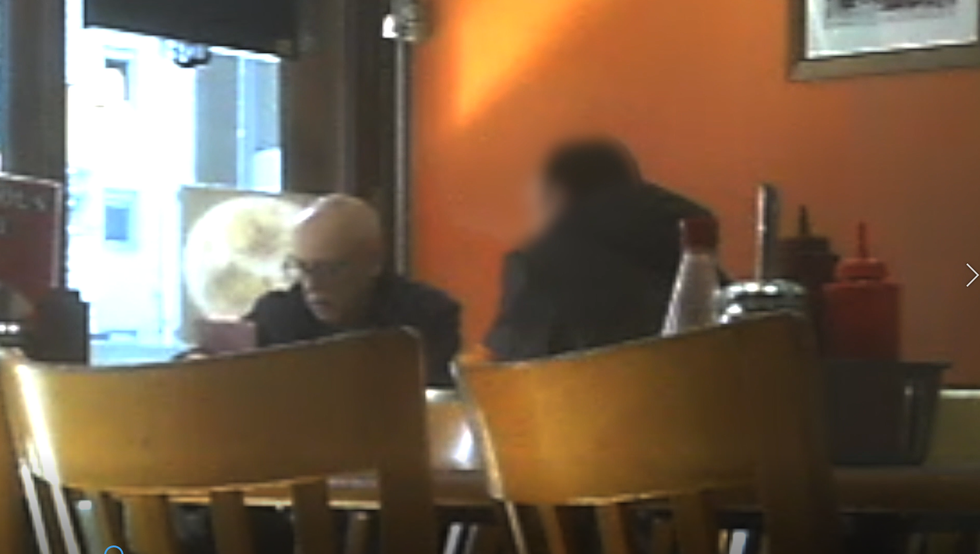 Beard photographed at a meeting