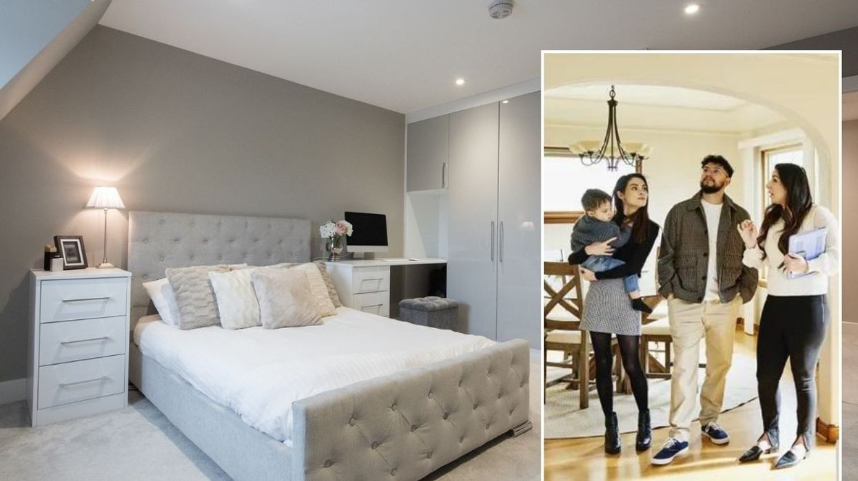 Bedroom with carpet / Potential buyers looking at a home