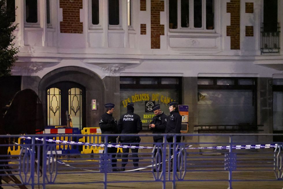 Belgian police secure the area after a shooting in Brussels, Belgium