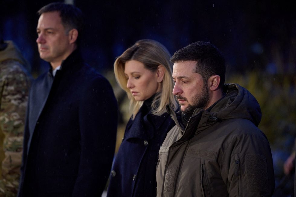 Belgium's Prime Minister Alexander De Croo, Ukraine's President Volodymyr Zelenskiy and his wife Olena visit a monument to Holodomor victims during a commemoration ceremony of the famine of 1932-33, in which millions died of hunger, amid Russia's attack on Ukraine, in Kyiv, Ukraine November 26, 2022.  Ukrainian Presidential Press Service/Handout via REUTERS ATTENTION EDITORS - THIS IMAGE HAS BEEN SUPPLIED BY A THIRD PARTY.