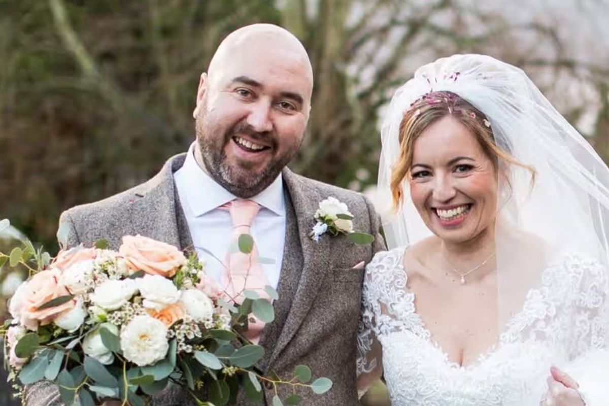 ​Ben Trotman pictured next to his wide on his wedding day 