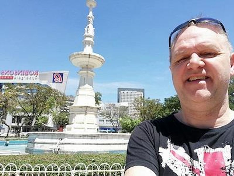 BEST QUALITY AVAILABLE Handout photo dated 01/04/19 issued by Cleveland Police of a selfie of ex-Radio One DJ Mark Page taken in front of the Robinson's department store in Cebu City, which was shown in court to disprove his alibi. The 63-year-old divorced father-of-three from Stockton, Teesside, has been jailed for 12 years at Teesside Crown Court after he was convicted on Wednesday of four counts of arranging the commission of a child sex offence, between 2016 and 2019. Issue date: Thursday March 10, 2022.