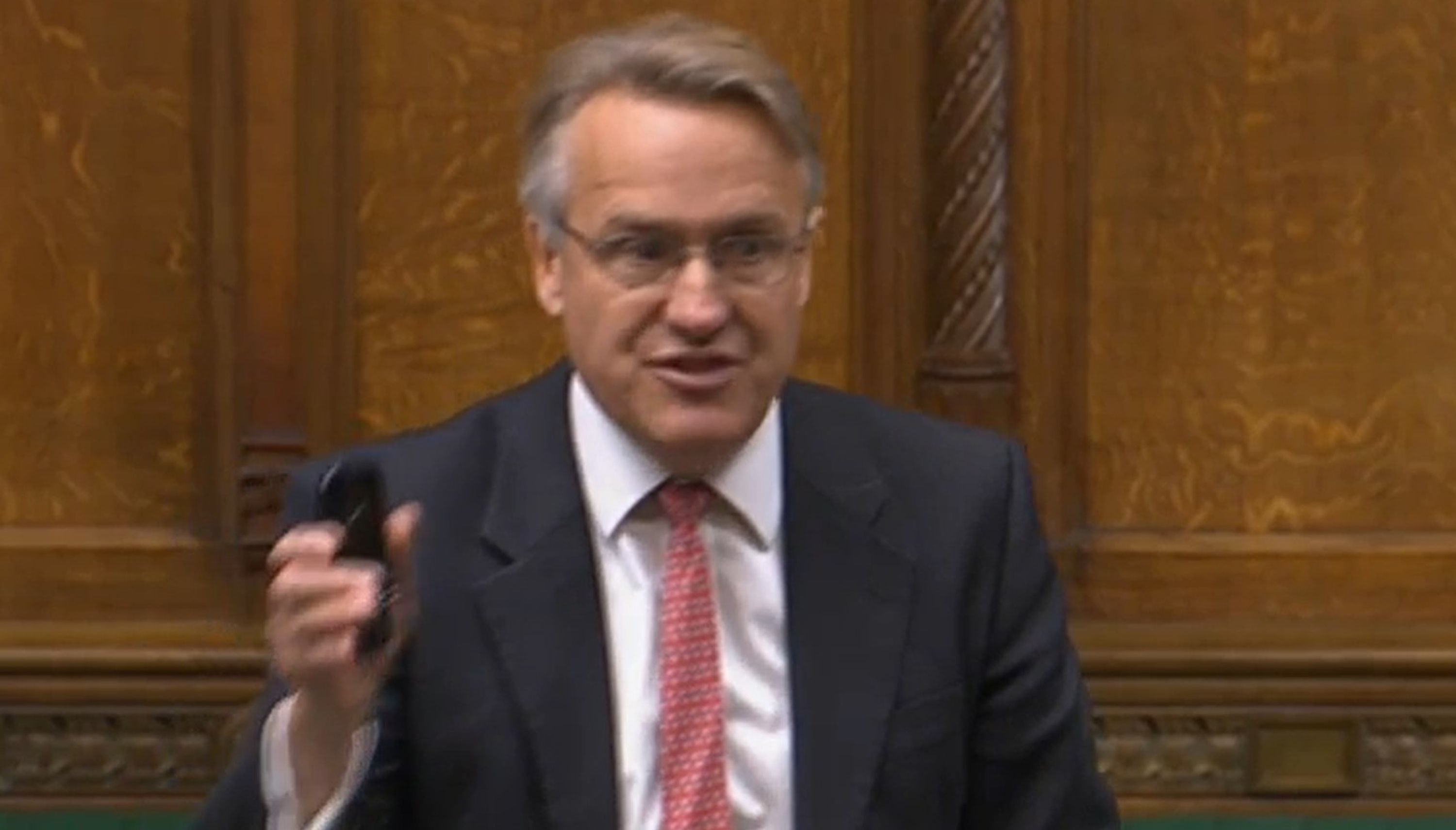BEST QUALITY AVAILABLE Video grab issued by UK Parliament of Sir Charles Walker waving his mobile device in the House of Commons, London, as he jokingly questioned why %22nothing happens%22 when he messages Nadhim Zahawi. The Conservative MP said his Nokia phone is the reason why the Education Secretary is not answering his pleas to repair a school. Issue date: Thursday June 30, 2022.
