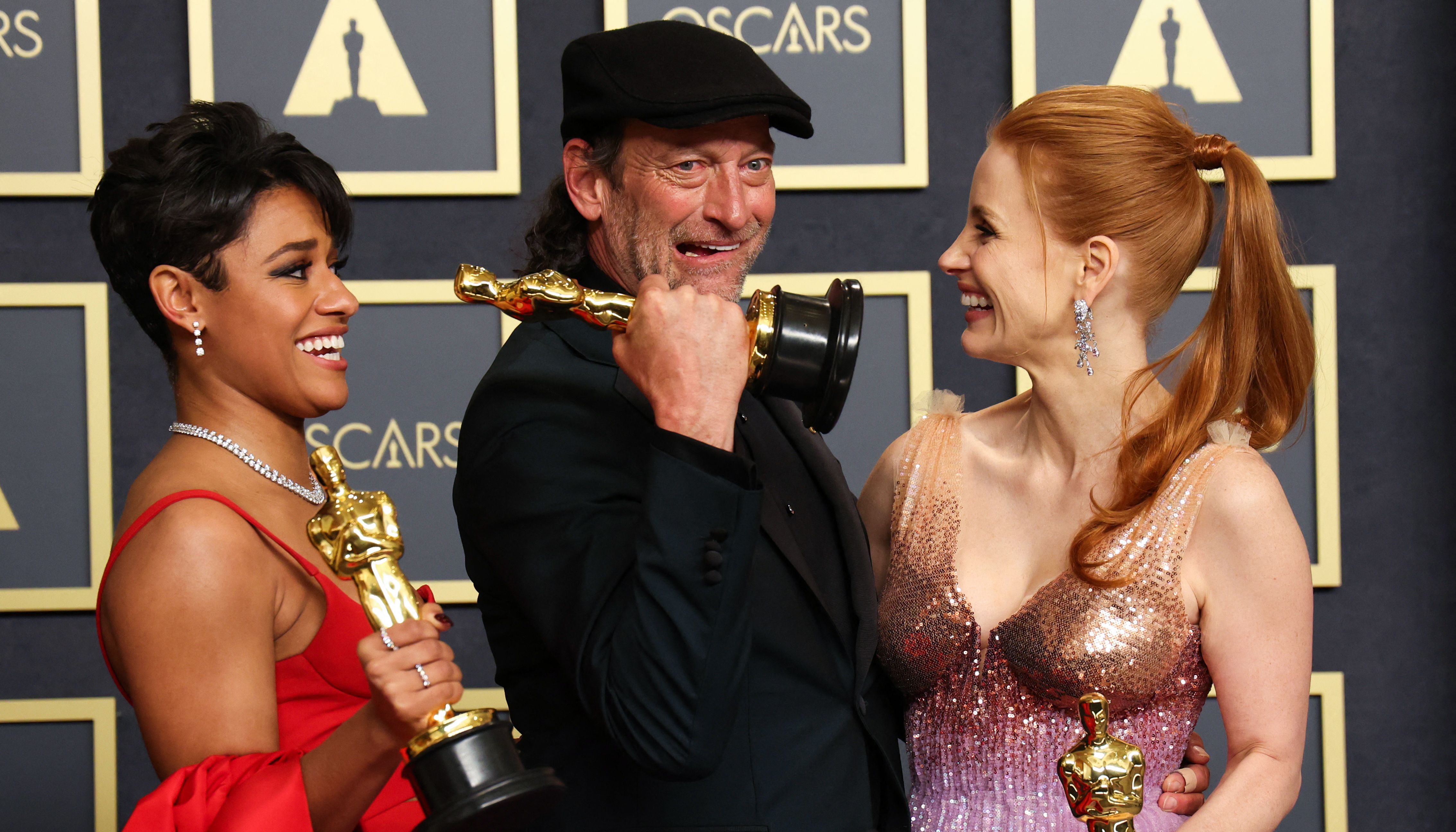 Best Supporting Actress winner Ariana DeBose, Best Supporting Actor winner Troy Kotsur and Best Actress winner Jessica Chastain pose with their Oscars in the photo room during the 94th Academy Awards in Hollywood, Los Angeles, California, U.S.