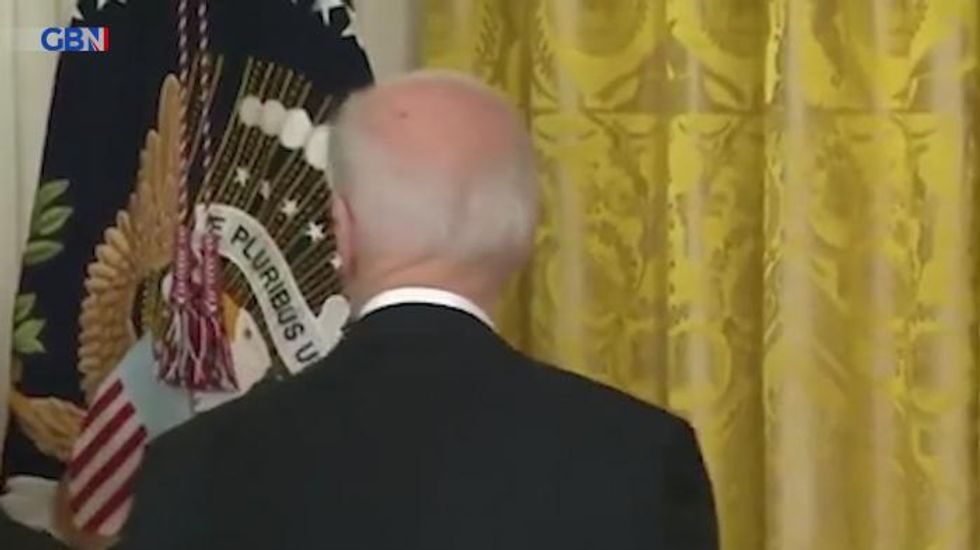 Joe Biden looks lost as staff appear to ignore him and flock to Barack Obama at White House event – video