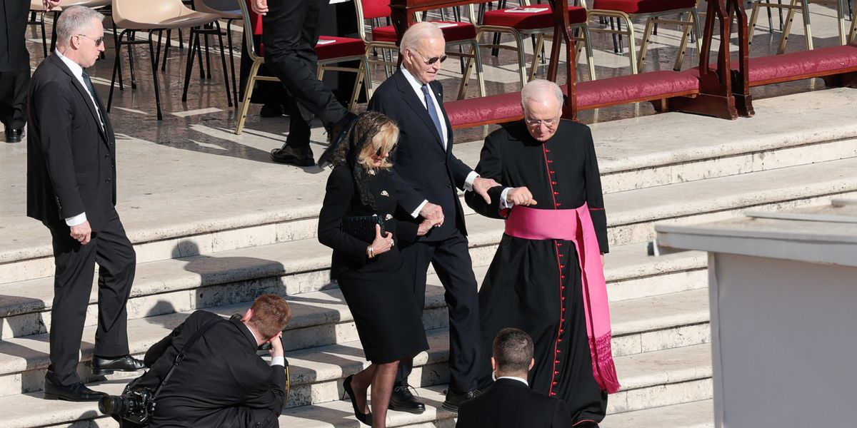 NextImg:Frail Joe Biden given helping hand by wife Jill and bishop as he struggles down stairs at Pope Francis's funeral