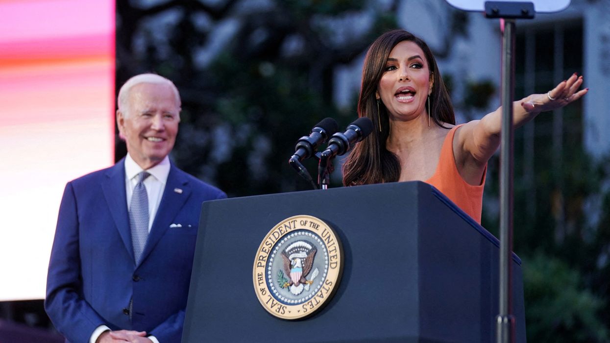 Biden looks on at Longeria