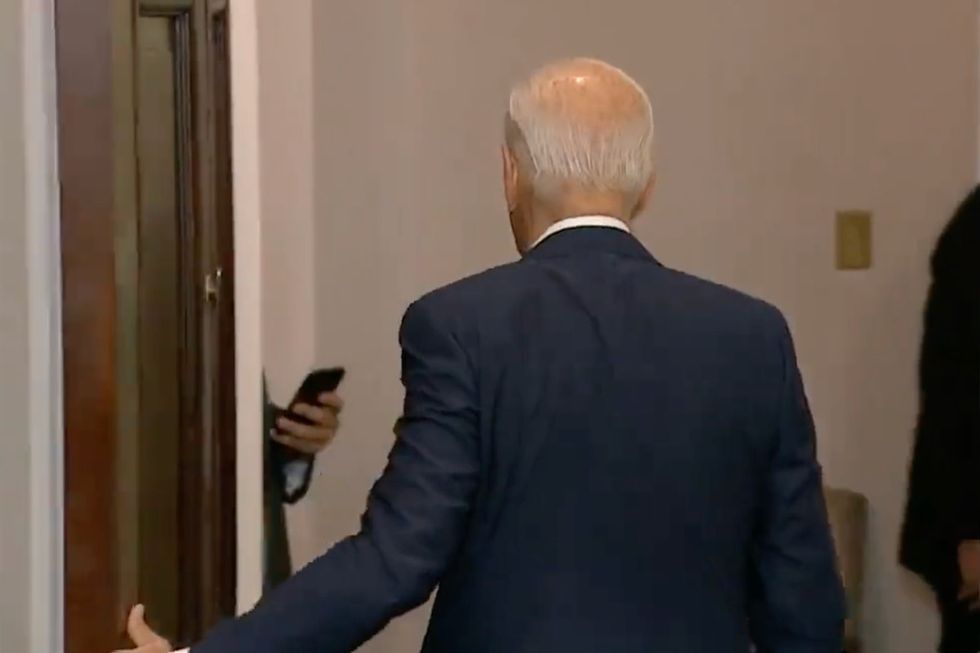 Biden pulls door closed behind him