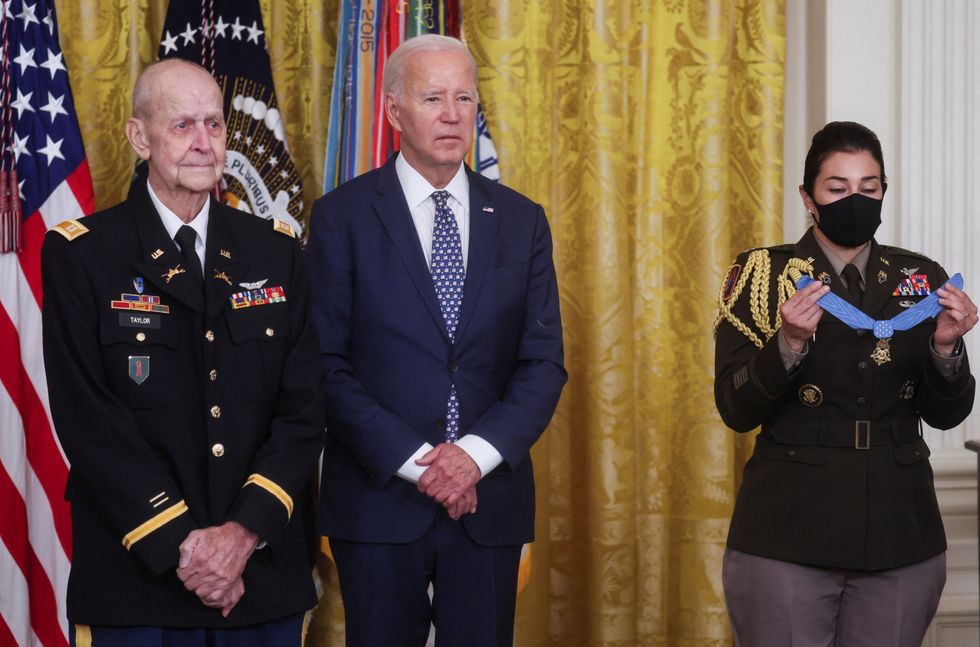 Biden stood next to the veteran for four minutes without wearing his mask