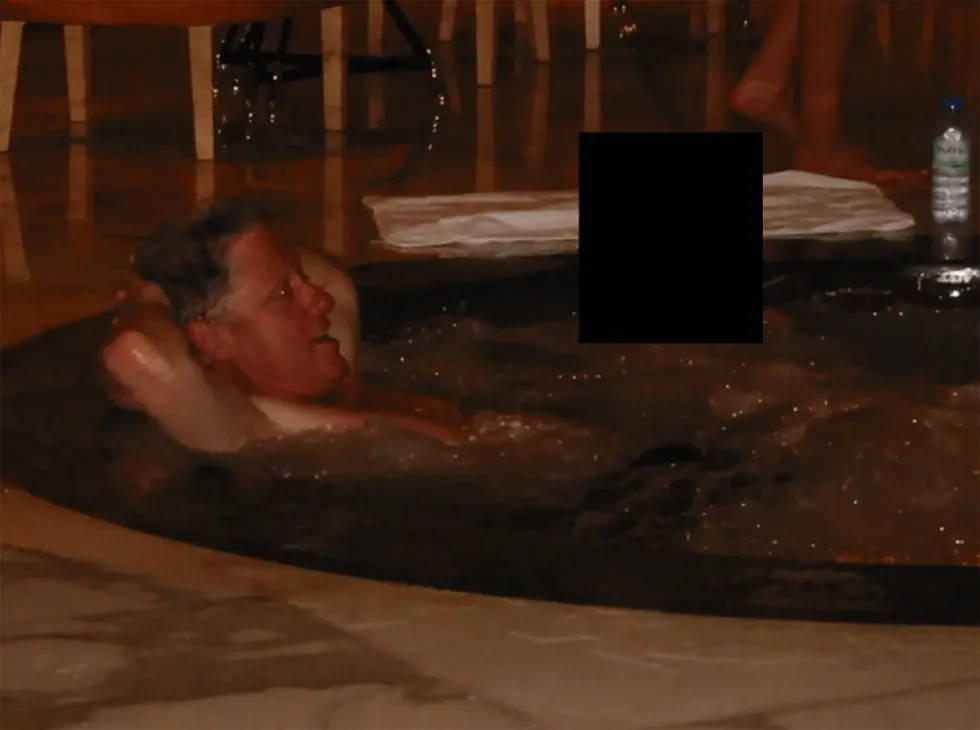 Bill Clinton relaxes in a hot tub