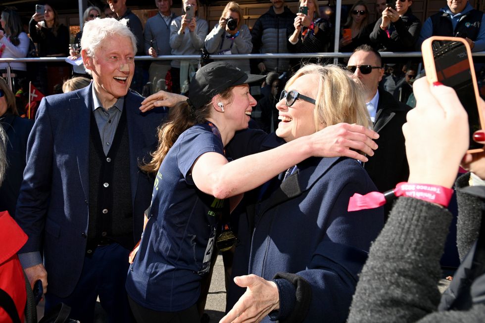 Bill Clinton seen sporting mysterious face bandage as he greets daughter Chelsea