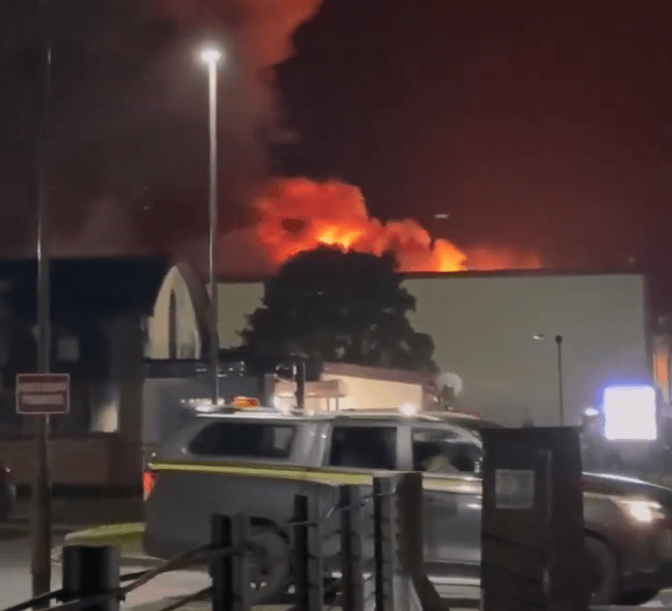 Billows of smoke rise from a building on the RAF Fairford military base