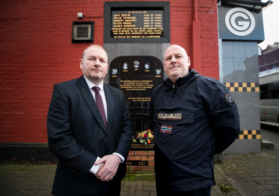Billy McManus (left), whose father William was killed in the Sean Graham shooting, stands at the memorial for those killed during the attack on 5 February, 1992 with Mark Sykes, who survived being shot four times during an attack which also claimed the life of his 18-year-old brother-in-law, Peter Magee.