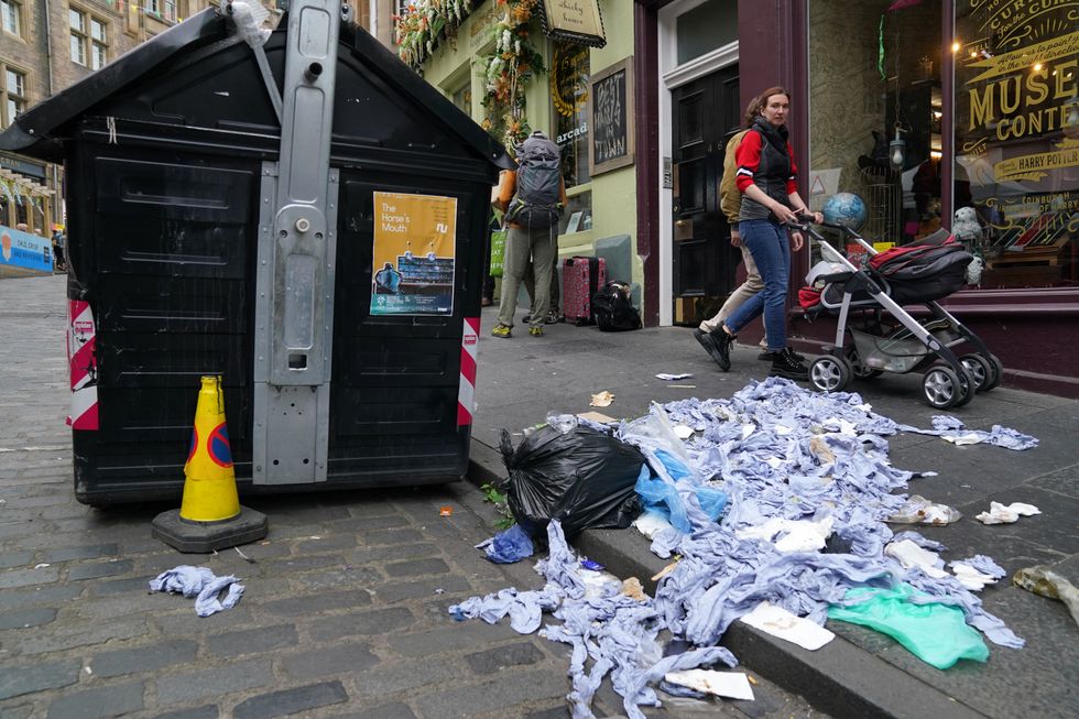 Bins in Cockburn Street in Edinburgh. Cleansing workers at the City of Edinburgh Council will begin eleven days of strike action. Picture date: Thursday August 18, 2022.