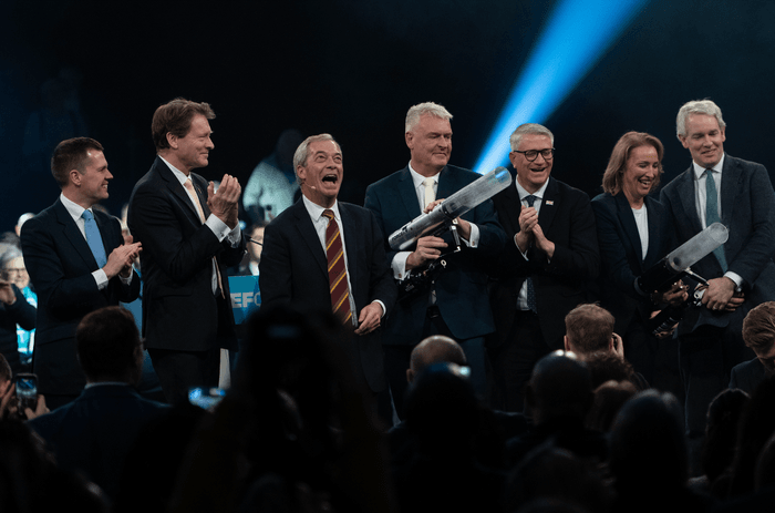 BIRMINGHAM, UNITED KINGDOM - FEBRUARY 09: Robert Jenrick MP (L), Richard Tice (2nd L), Nigel Farage MP (3rd L), Lee Anderson MP (C), Andrew Rosindell MP (3rd R), Sarah Pochin MP (2nd R) and Danny Kruger MP (R) are seen on stage during a Reform UK party rally at the National Exhibition Centre (NEC) in Birmingham, United Kingdom on February 09, 2026.