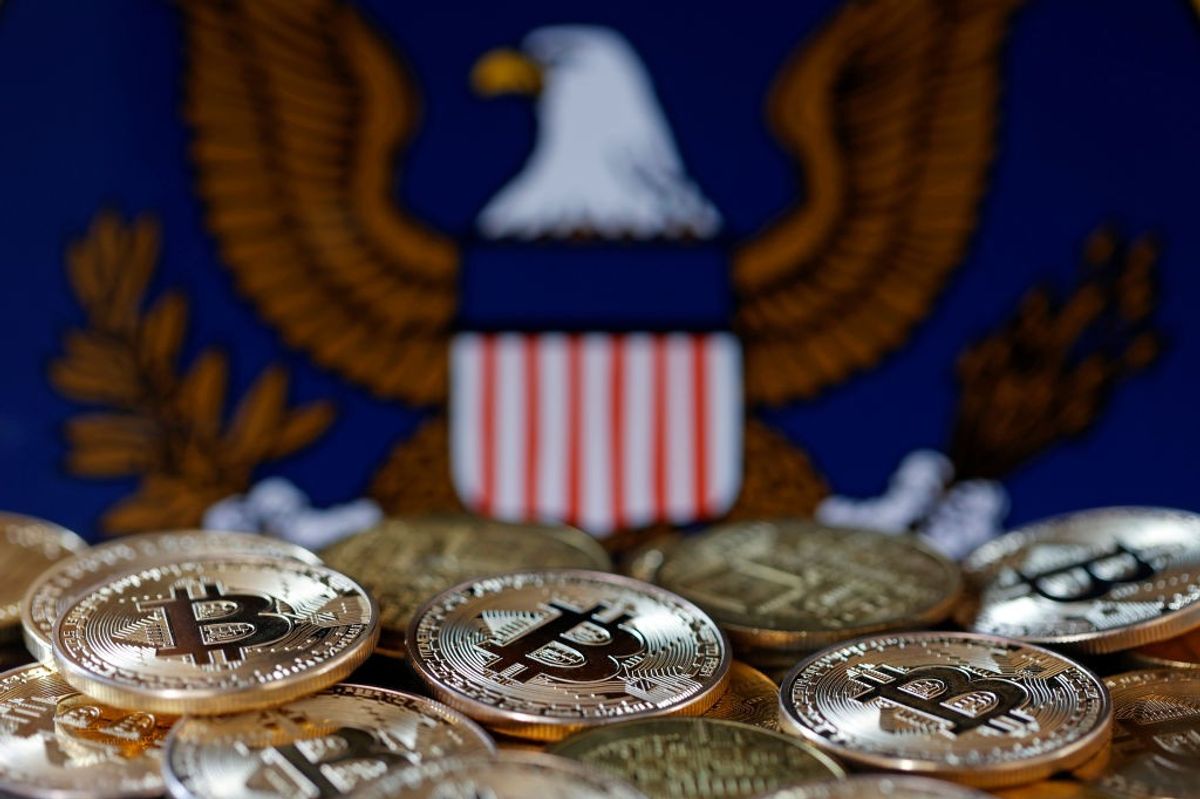 Bitcoin coins and SEC logo 