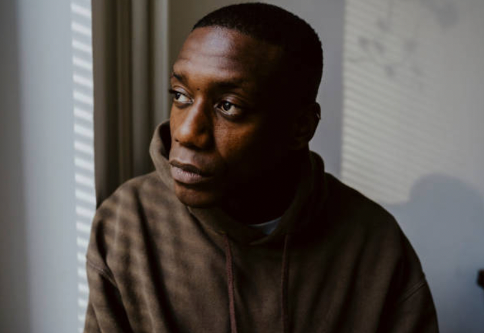 Black man looking sad