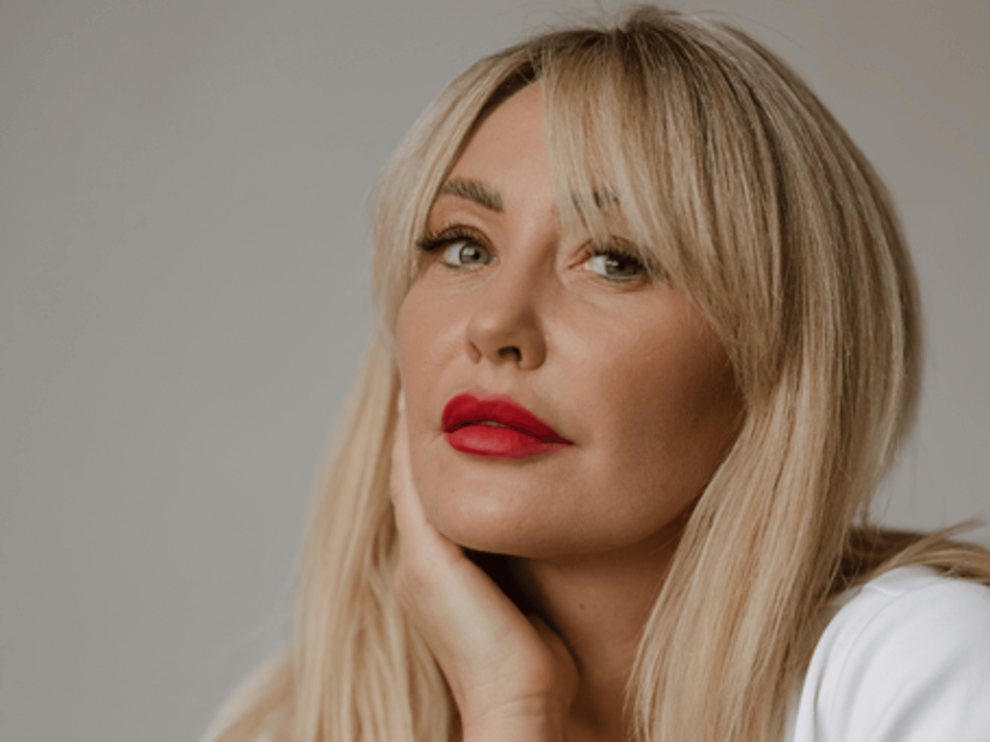 Blonde hair woman red lip stick