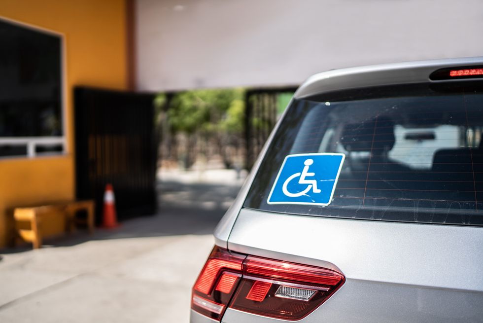 blue disabled sign in car
