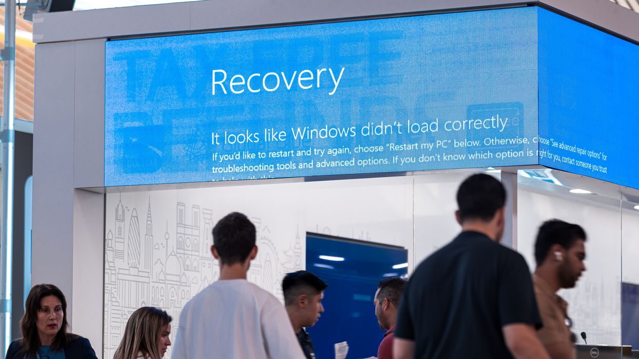 Blue Screen of Death shown on a television screen in an airport