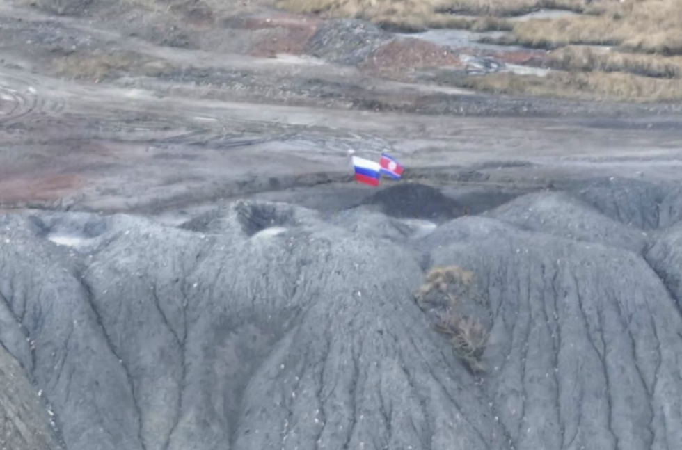 Blurry image that is suspected to be the North Korean flag next to Russia's