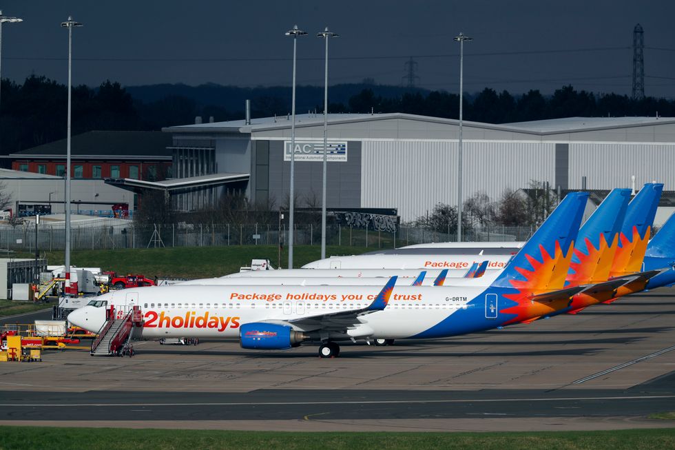Boeing 737-85P (G-DRTM) (foreground) one of several planes owned and operated by Jet2 at Birmingham Airport.