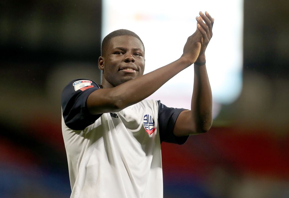 Bolton Wanderers' Yoan Zouma applauds the fans