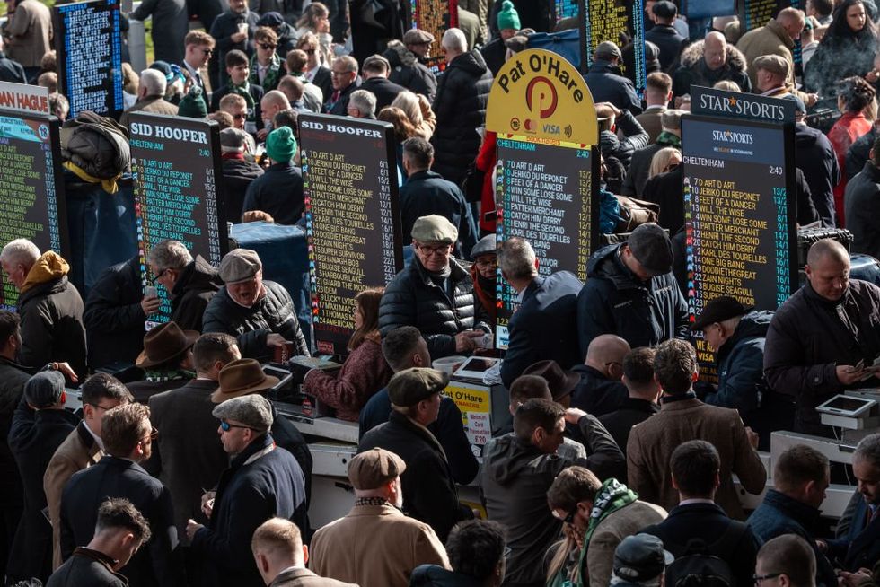 Bookmakers work at Cheltenham Racecourse
