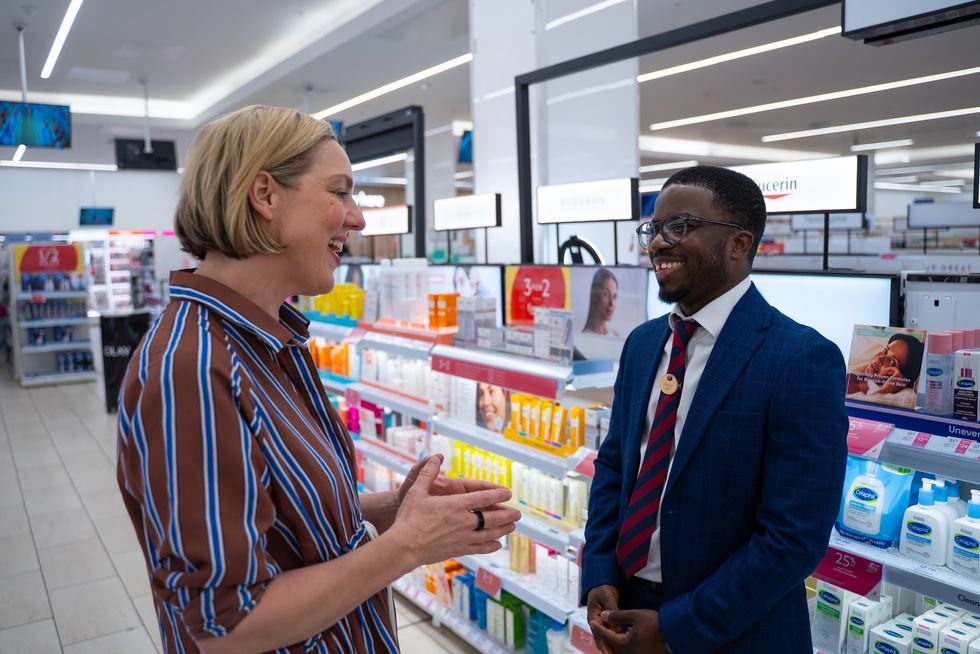 Boots pharmacist and customer