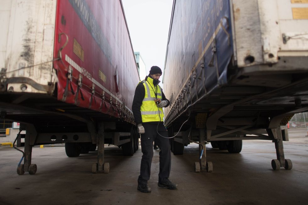 Border Force staff check a lorry for migrants
