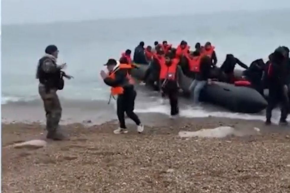 Border officials meet Channel crossing migrants