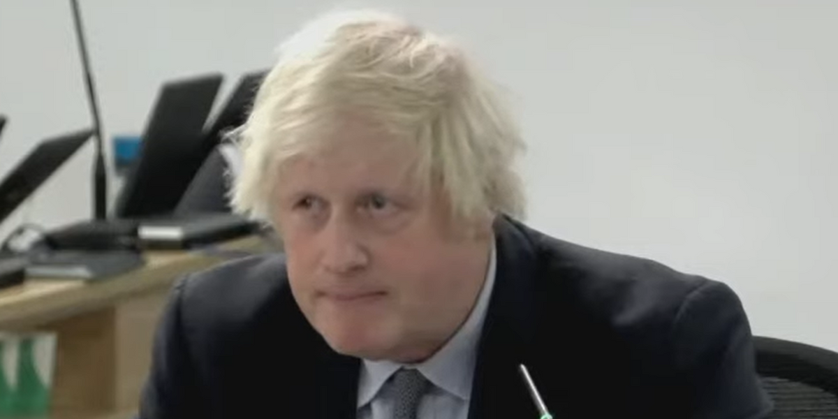 NextImg:Boris Johnson Covid inquiry hearing derailed just MINUTES after starting as furious protester heckles ex-PM