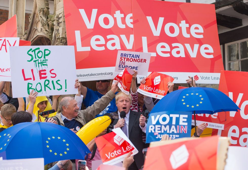 Boris Johnson is surrounded by Vote Leave and Vote Remain activists as he speaks in Winchester