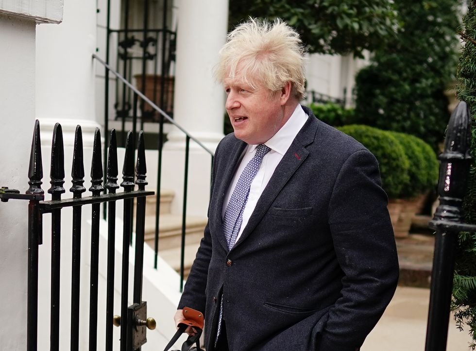 Boris Johnson leaving his home