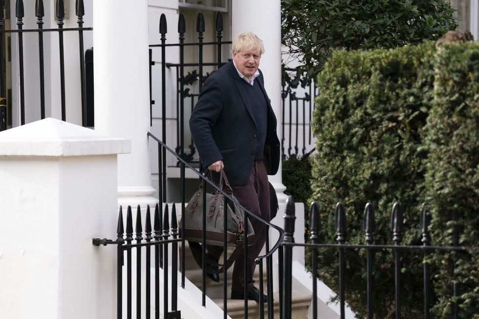 Boris Johnson leaving his home
