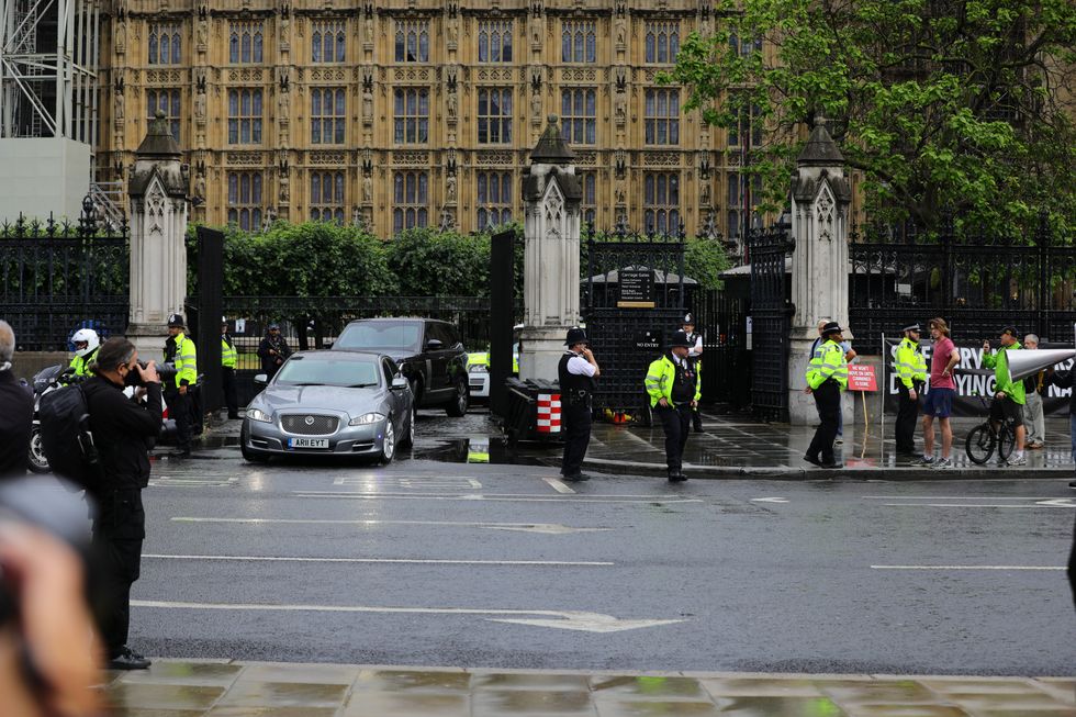Boris Johnson's Jaguar leaves the Houses of Parliament