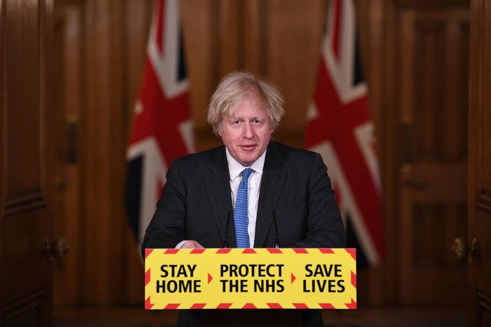 Boris Johnson with 'Stay Home, Protect the NHS' messaging