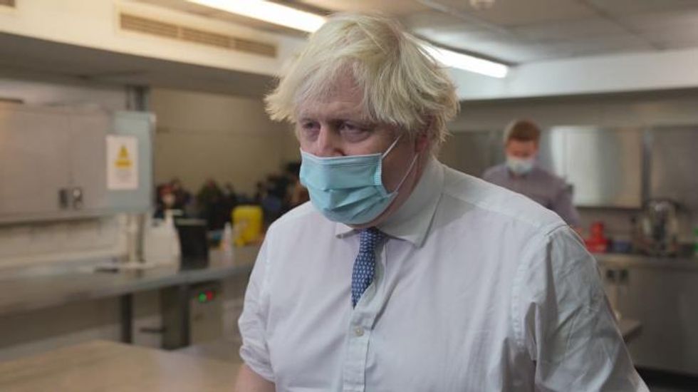 Boris Johnson seeks to win over Tory rebels as Covid health pass revolt looms